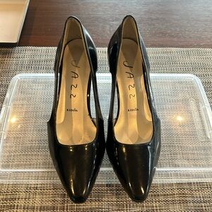 Black Patent leather pumps by Jazz.  Size 5.5.  Excellent pre worn condition.